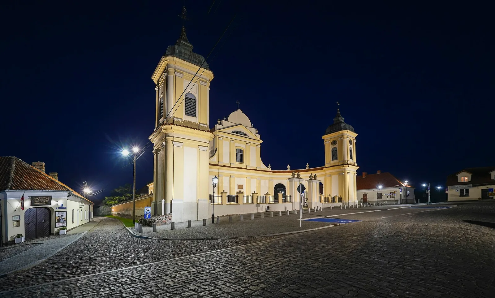 Church of the Holy Trinity in Tykocin , at 2 11 Listopada Street in Tykocin , Podlaskie Voivodeship , Poland , on 11 September 2024. The photograph shows a night view of the illumi