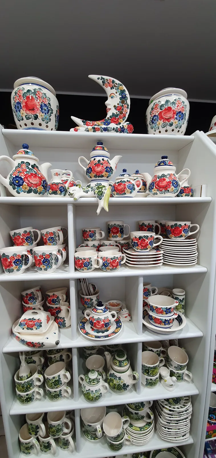 Colorful products from the faience factory in Włocławek, hand-painted in various patterns